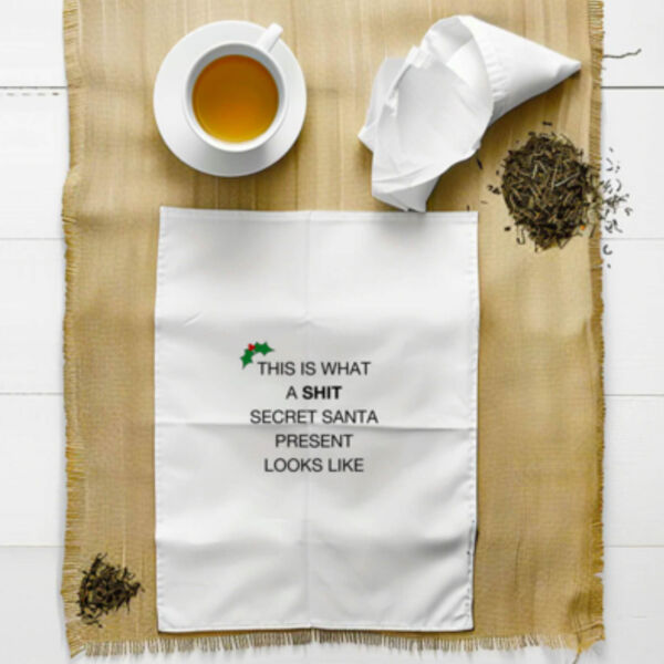 "This is what a shit secret santa present looks like" Tea Towel Thumbnail